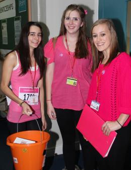 Girls in pink collecting donations
