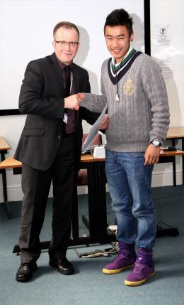 A student receives their certificate