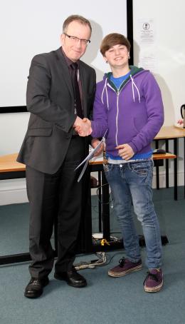 A student receives their certificate