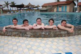 Relaxing in the pool in Accra after the long flights to Ghana, l-r: Harry Scott, Ross Brett-Holt, Rebecca McCallan, Jonathan Moon and Matthew Baldwin.