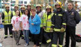Elinor Doughty, Danielle Hearn and Chris Eustace with a team from the Hampshire Fire and Rescue Service